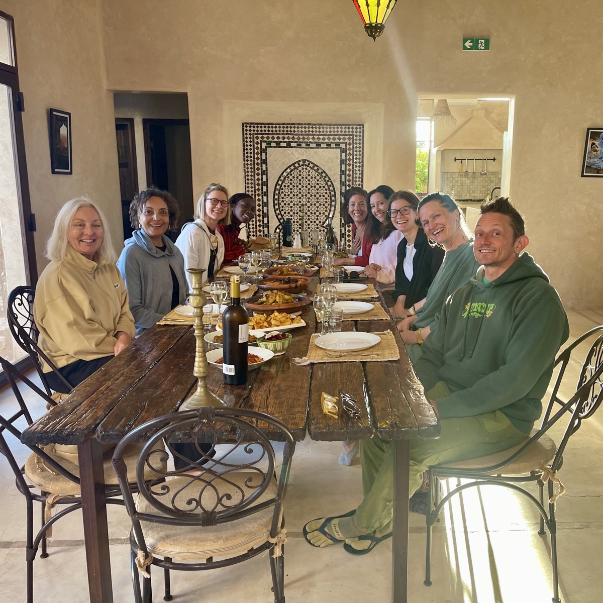 Guests sharing dinner together at the villa