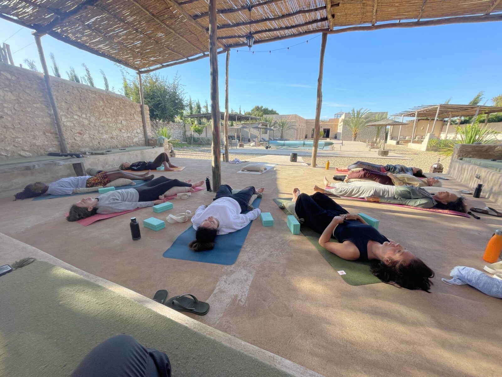 Savasana under the pergola after practice